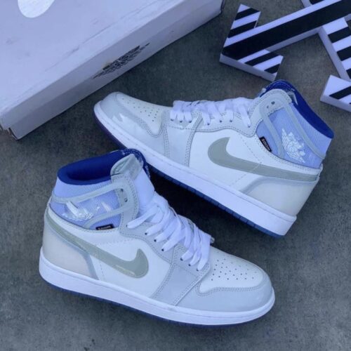 JORDAN RETRO 1 BOTA BLANCA AZUL CHAROL